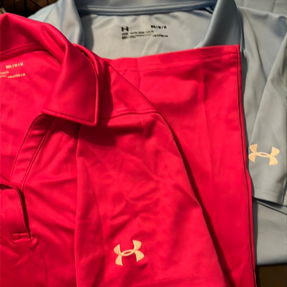 Two medium Under Armour collared short sleeved golf type ladies tops for sale